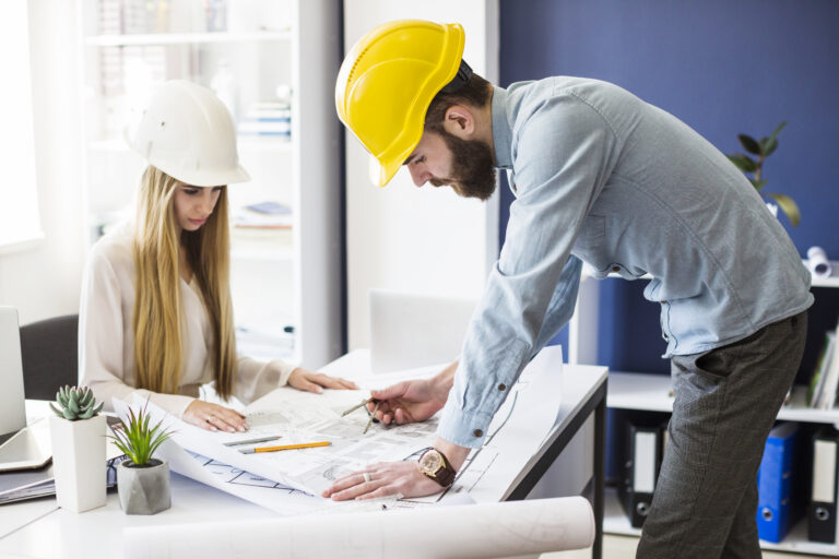 male-engineer-drawing-plan-blue-print-with-architect-equipment.